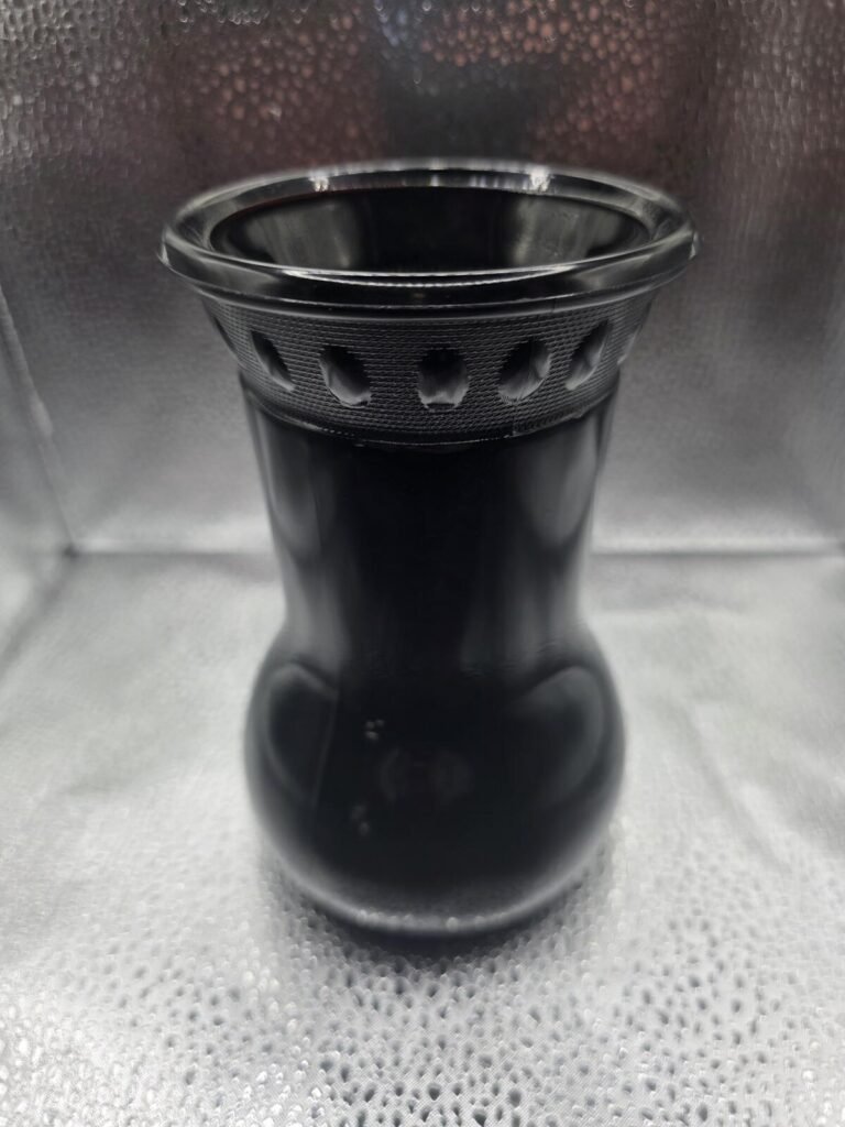 Close top view of black amethyst glass vase showing pierced reticulated rim, inner lip and upper hourglass neck.