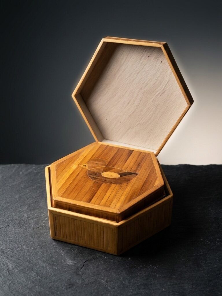 Open hexagonal bamboo trinket box with marquetry duck inlay on the lid and visible light wood interior.