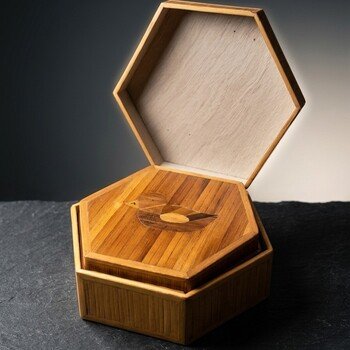 Angled view of the open hexagonal bamboo box showing the duck marquetry lid and vertical bamboo veneer sides.