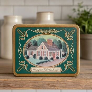 Wider front view showing the tin's decorative gold corner details and 'Original Toll House Cookie' banner on the lid