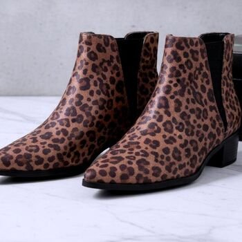 Leopard print ankle boots, front-right three-quarter view highlighting pointed toe, low block heel and brown/black spotted pattern
